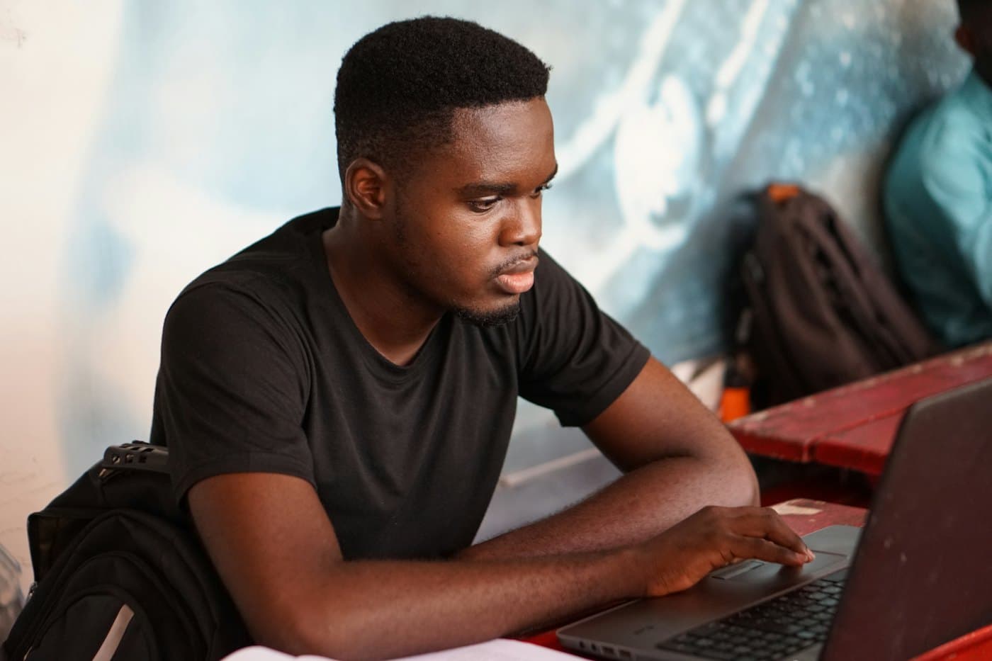 Student attending an online class from a laptop